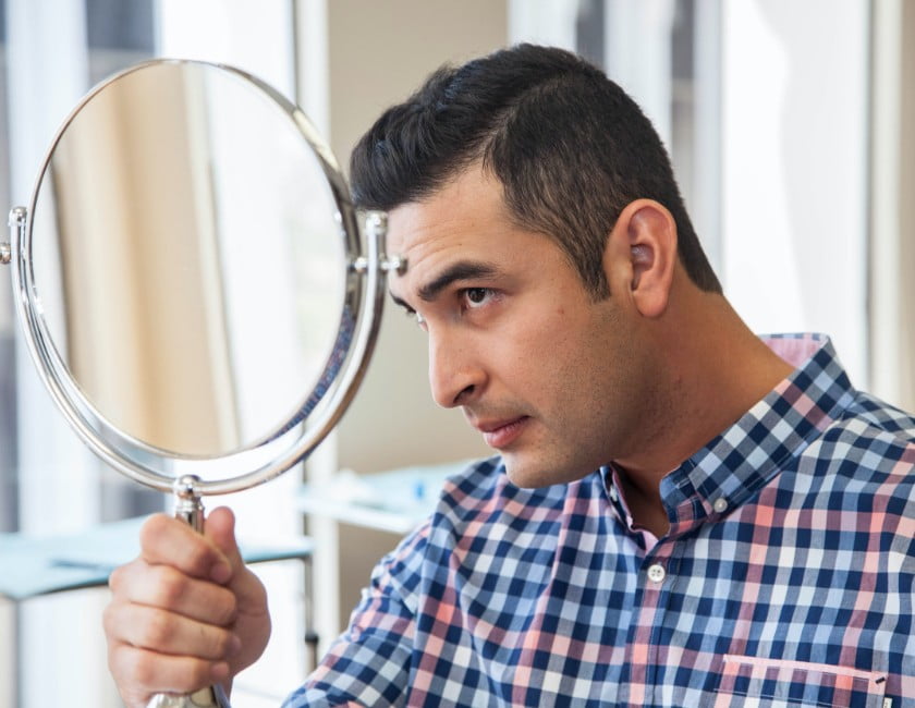 man looking in the mirror