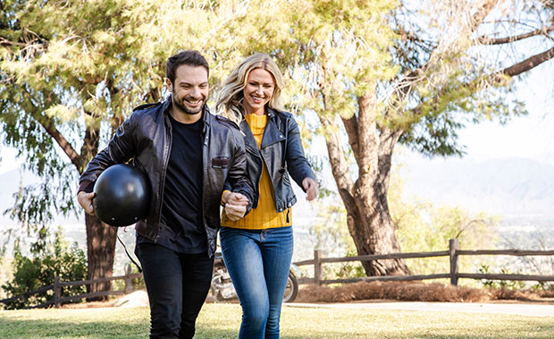 man and woman walking holding hands